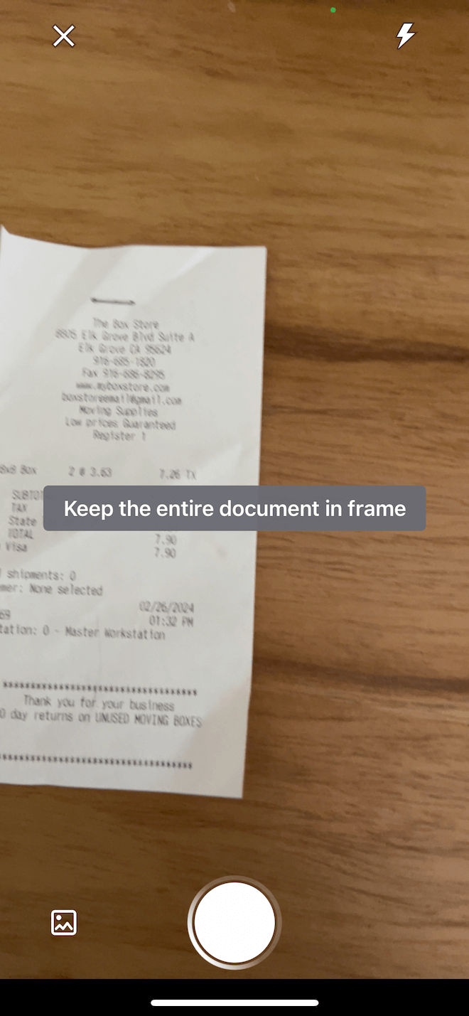 A screenshot of the receipt capture feature showing a text overlay that says 'keep document in frame'.