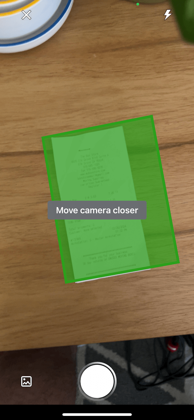 A screenshot of the receipt capture feature showing a text overlay that says 'move camera closer'.